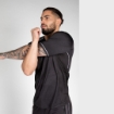 Men's Gym T-shirt by Gorilla Wear. This T-shirt is lightweight, breathable, quick-drying, and sweat-wicking. The breathable polyester and mesh sides keep you cool and focused. The smooth fabric is also perfect for grappling and martial arts.